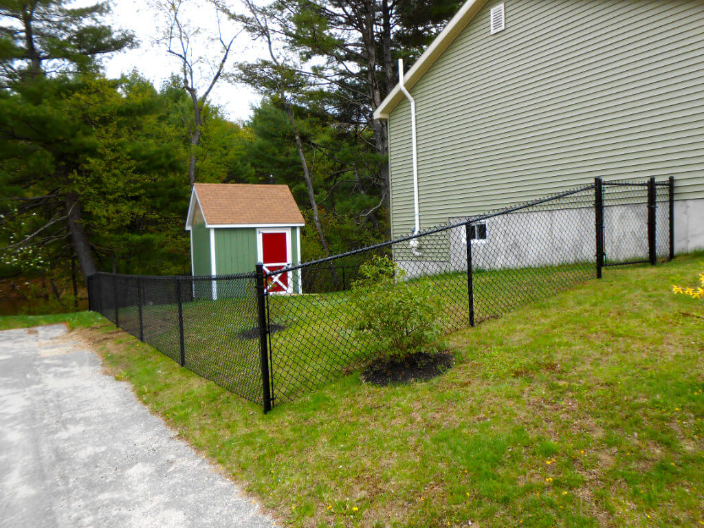 Residential black chain link fence installation