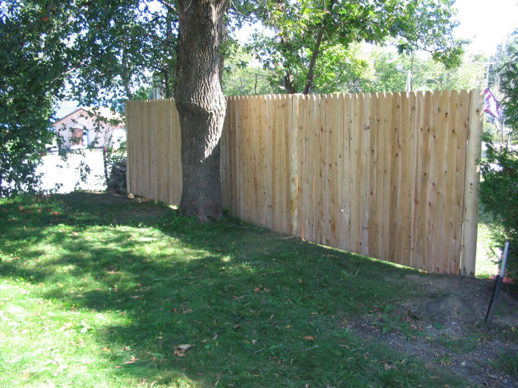 solid-cedar-privacy-fence-5-cathedral-top-solid-board-panel-with-round-post